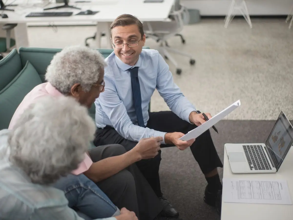 Consultant reviewing plans with clients