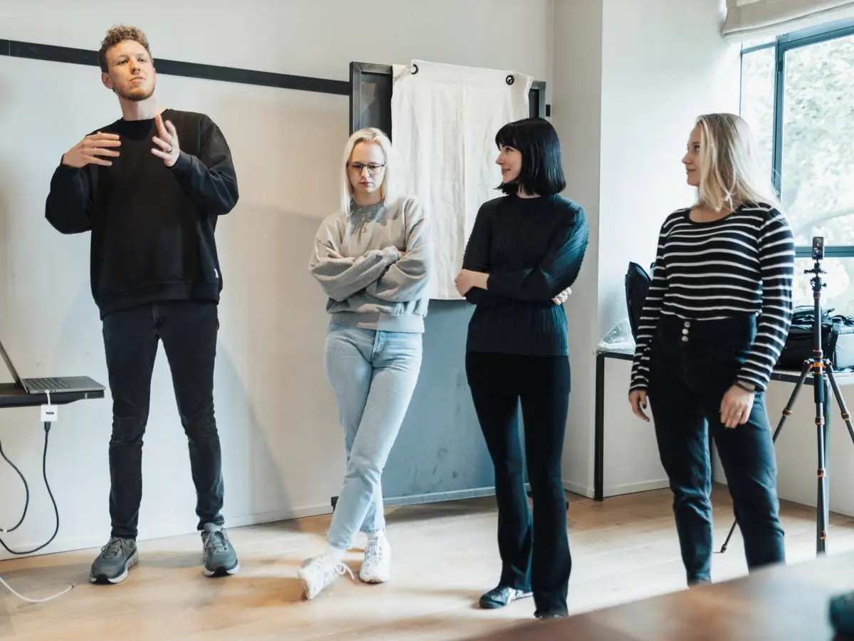 Presenter leading a discussion with colleagues