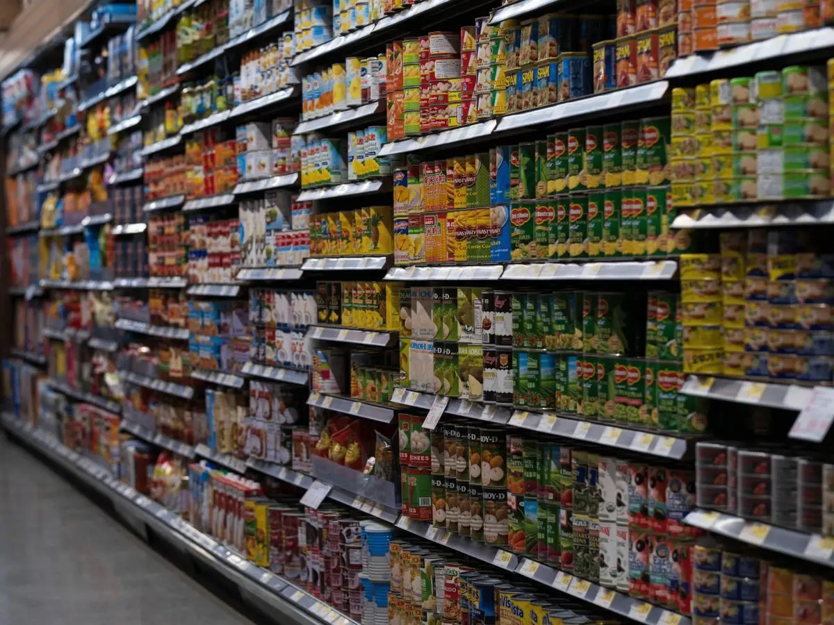 Supermarket aisle with stocked shelves