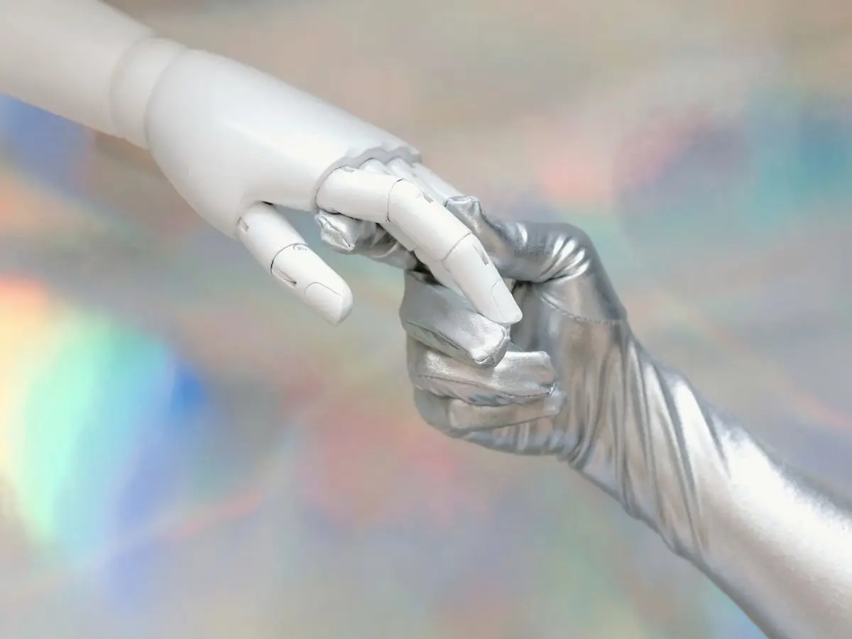 Robotic hand meeting a human hand