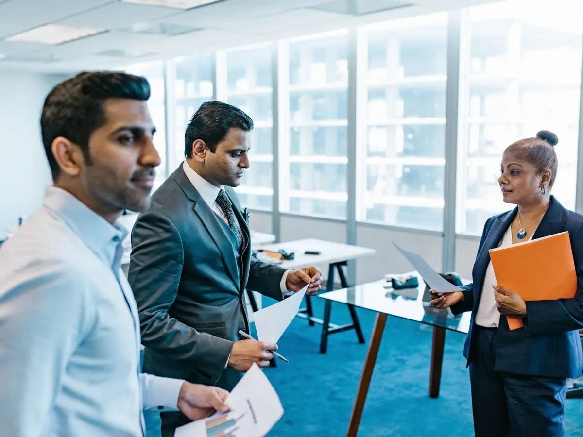 Professionals discussing a strategy document