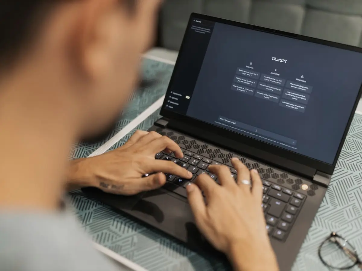 Person using an AI assistant on a laptop