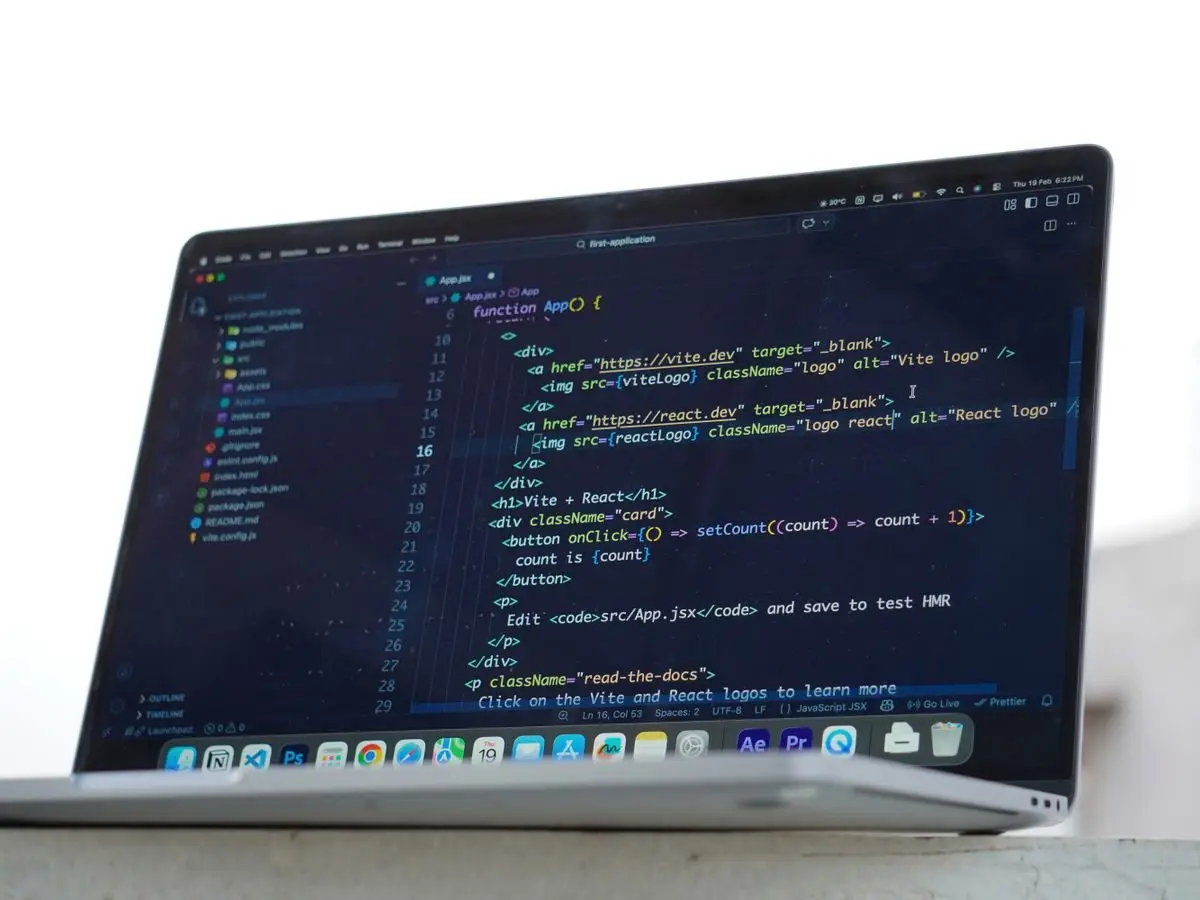 Developer coding on a laptop