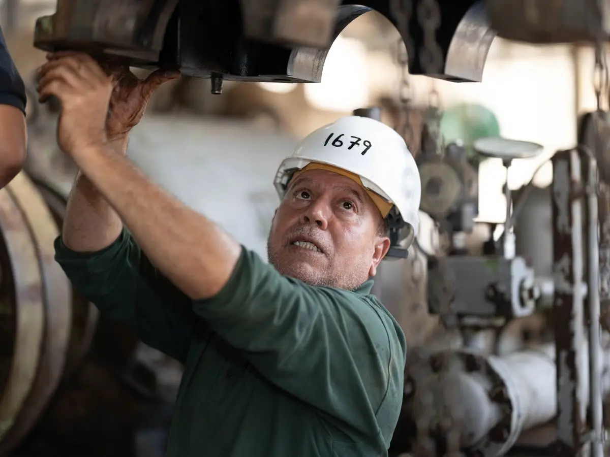 Engineer inspecting heavy machinery