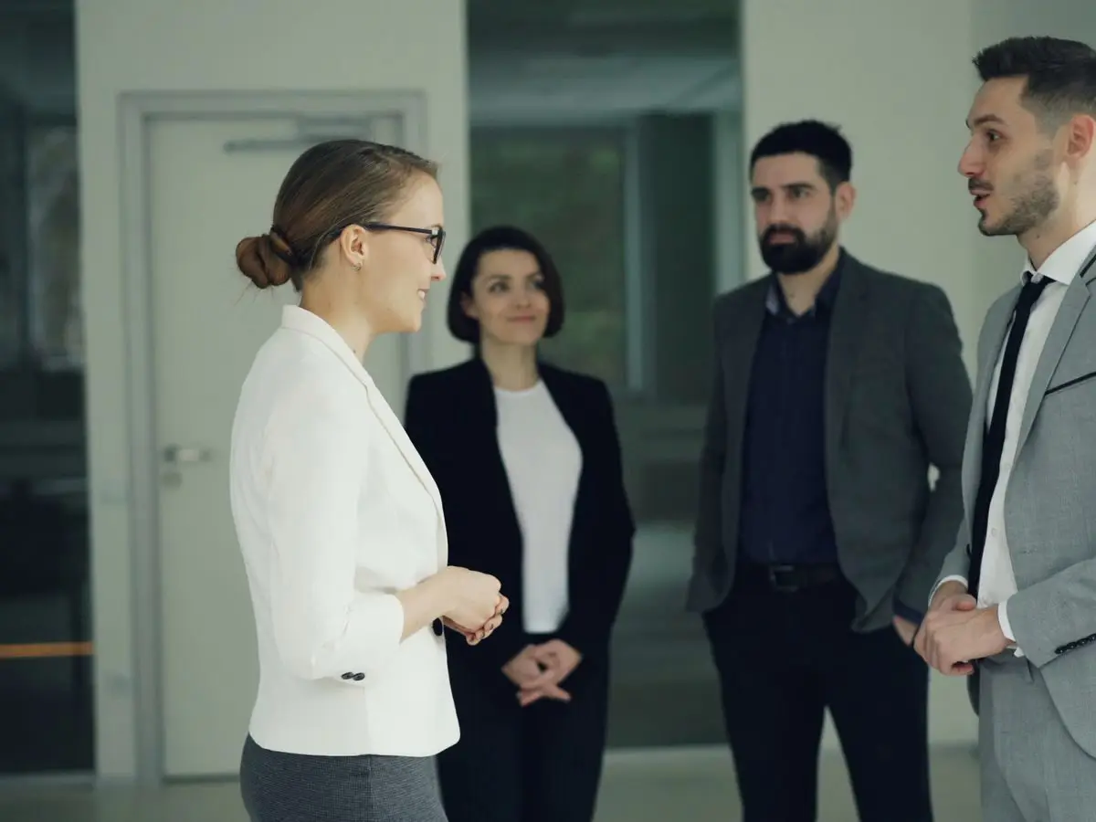 Professionals in a discussion in a modern office