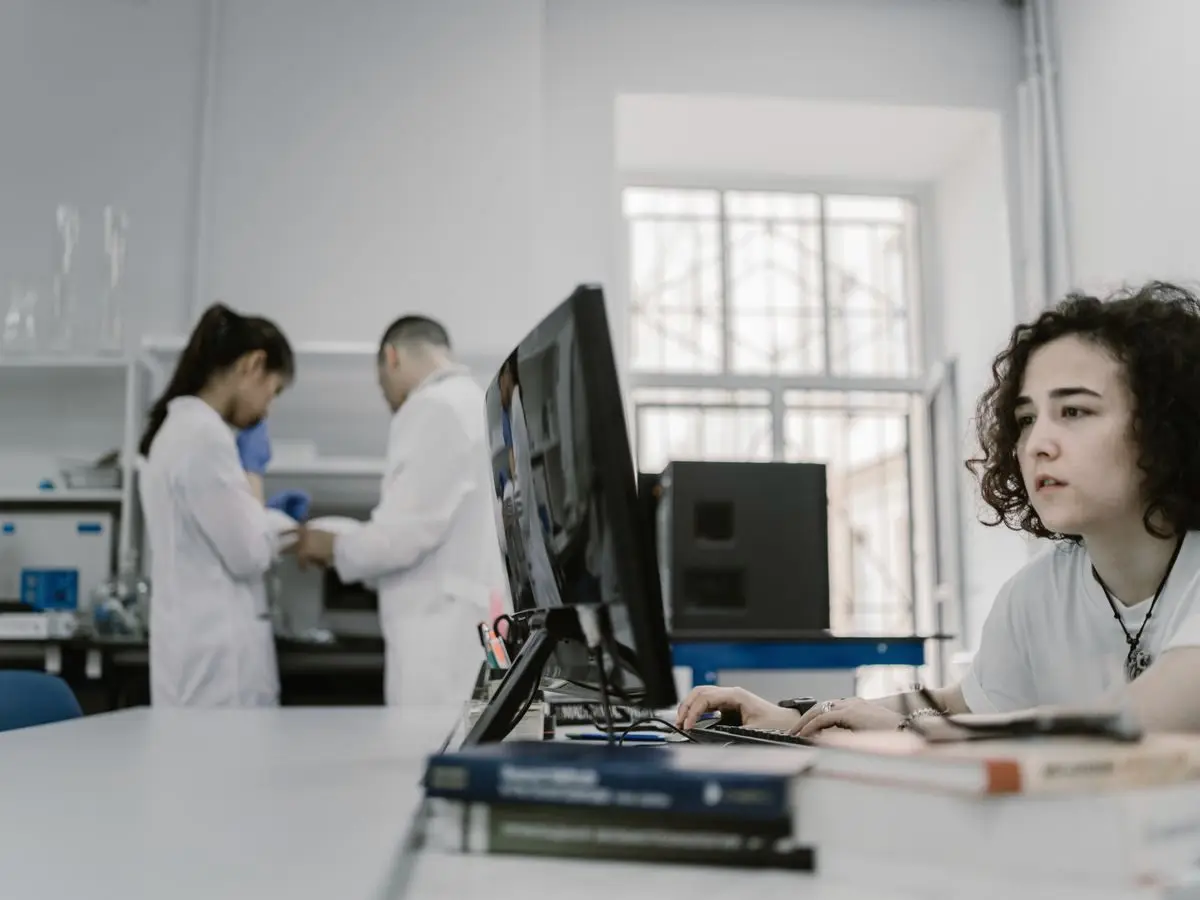 Analyst working at a computer in a lab